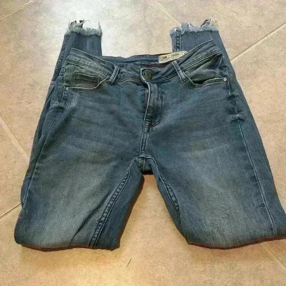 Mid-Rise Distressed Bella Skinny Jeans